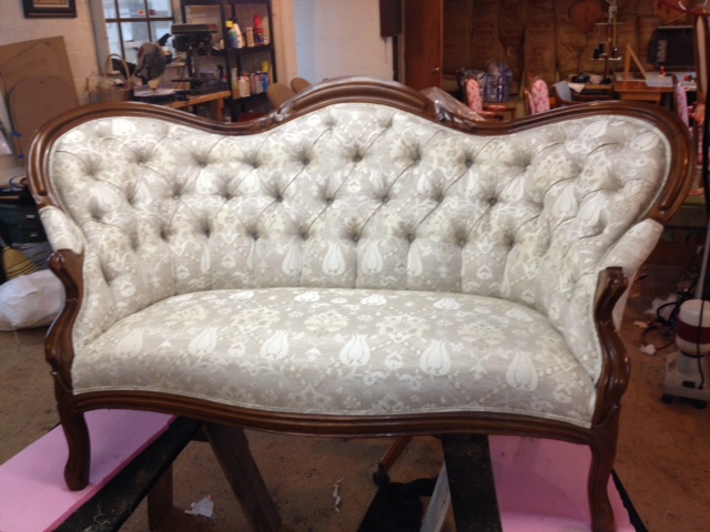 Tufted sofa with new nails by Portland Commercial Upholstery